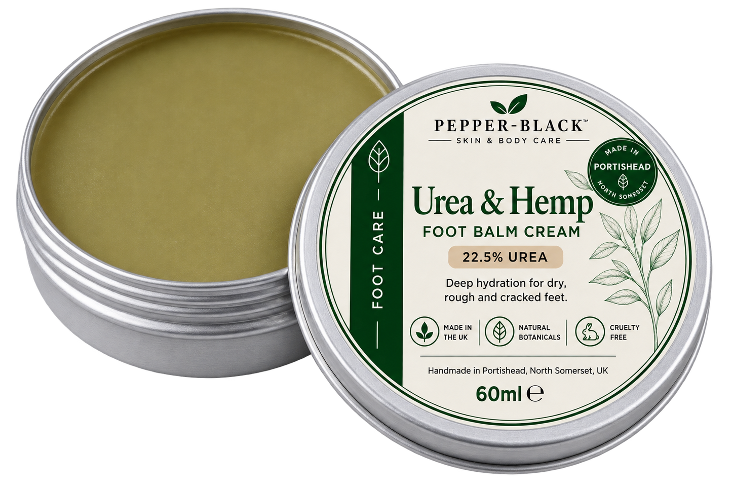 An open silver metal tin of Pepper-Black Urea & Hemp Foot Balm Cream showing the olive-green balm inside, next to the lid which features a white and green label.