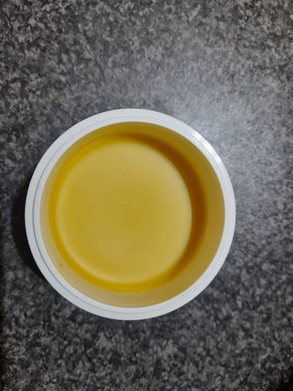 Close-up of balm texture showing thick, creamy consistency
