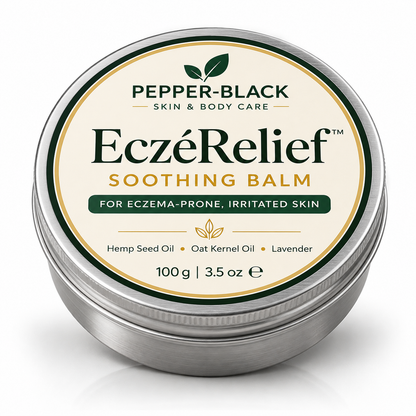 A round metal tin of Pepper-Black Skin & Body Care EczéRelief Soothing Balm, featuring a cream-colored label with green and gold text and graphics, set against a clean white background.