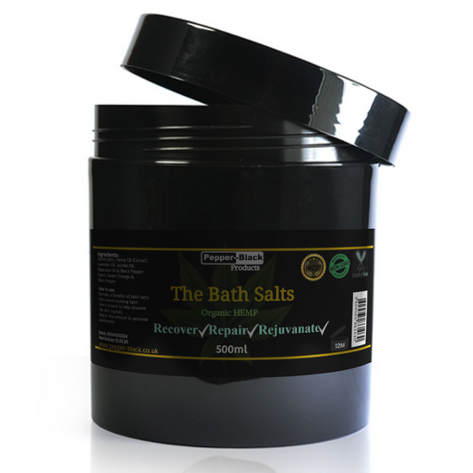 Black container of 'The Bath Salts' with a label on a white background