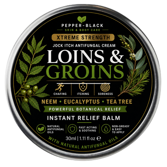 A round metal tin of Pepper-Black Xtreme Strength Loins & Groins Jock Itch Antifungal Cream, featuring a black label with green botanical illustrations and white and gold text.
